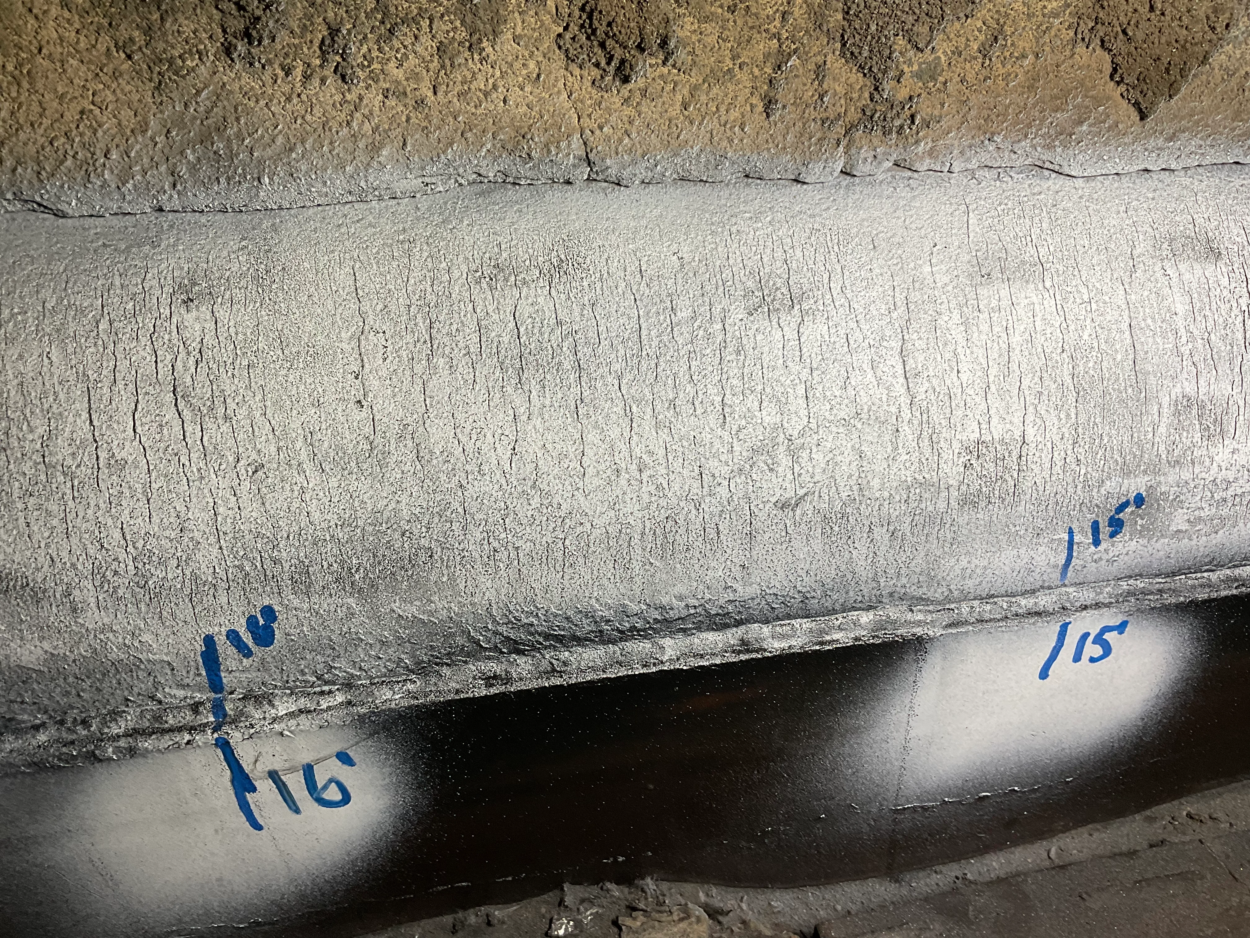 Mapped cracking and inspection markings on a furnace lower sidewall header