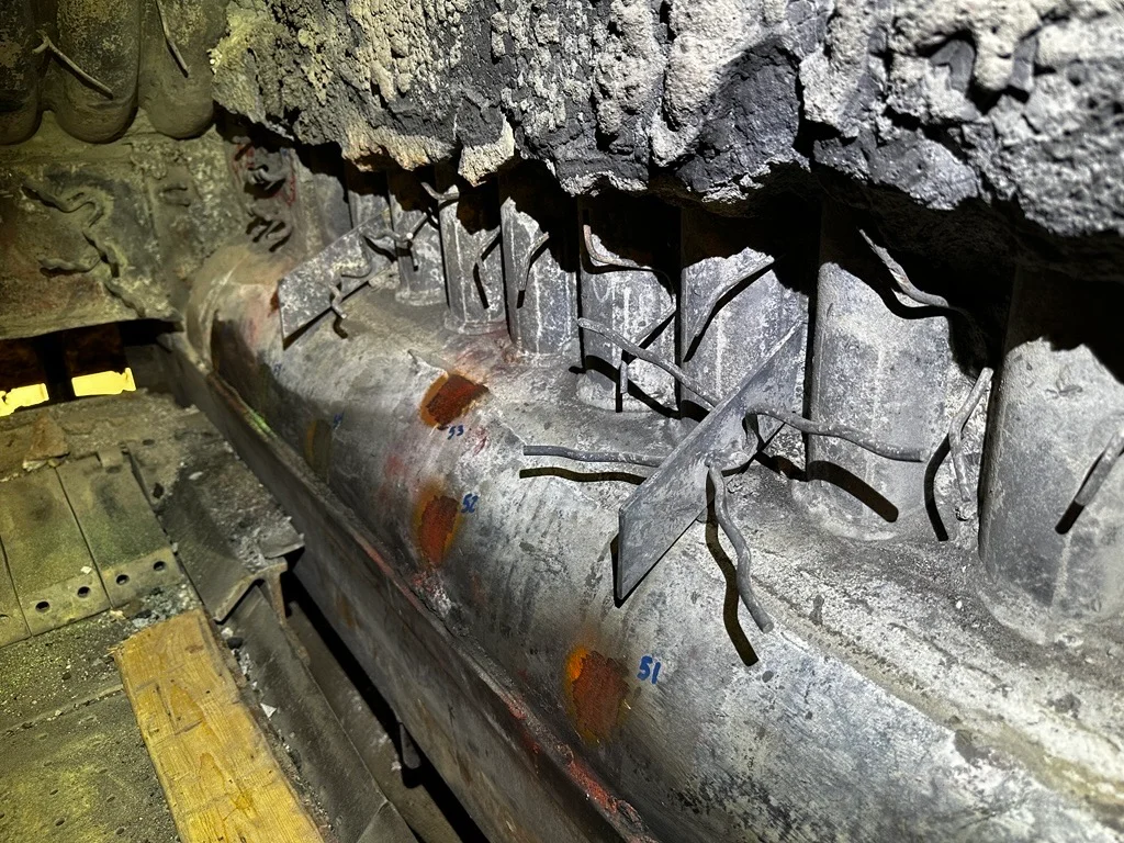 Lower sidewall header during follow-up inspection one year after repair